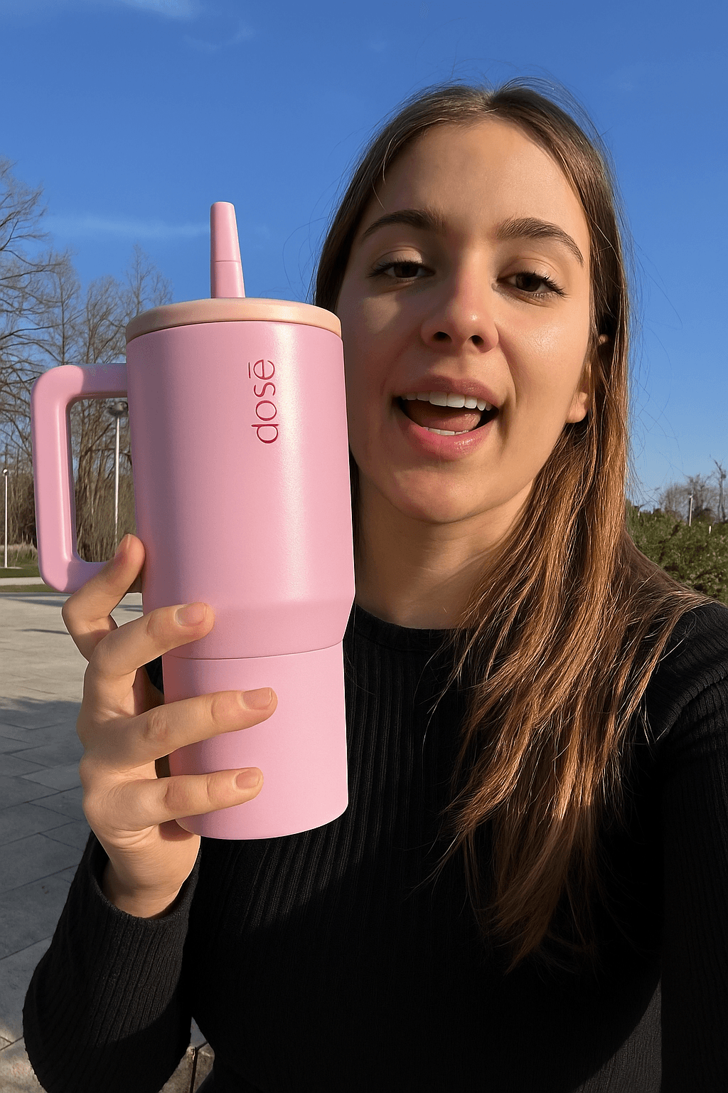 User holding DOSE thermos